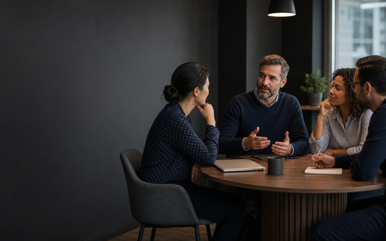 Small team discussing practical cybersecurity awareness